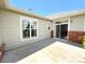 Backyard patio featuring access to the house through sliding glass doors and a large window at 3231 E 102Nd Pl, Thornton, CO 80229