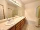 Bathroom features double sinks, a vanity, and a bath tub, creating a functional and stylish space at 3231 E 102Nd Pl, Thornton, CO 80229