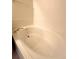 Relaxing soaking tub with gold hardware, set in a bright and clean bathroom for ultimate comfort at 3231 E 102Nd Pl, Thornton, CO 80229