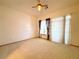 Bright bedroom with neutral carpet, natural light, and elegant curtains, offering a serene retreat at 3231 E 102Nd Pl, Thornton, CO 80229