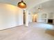 Open-concept living area featuring high ceilings, stylish lighting, and easy access to other rooms at 3231 E 102Nd Pl, Thornton, CO 80229