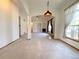Large, airy living room boasting high ceilings, stylish lighting and a fireplace at 3231 E 102Nd Pl, Thornton, CO 80229