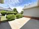 Private patio area with lush landscaping and a view of neighborhood greenery at 3231 E 102Nd Pl, Thornton, CO 80229