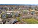Aerial view of a vibrant neighborhood with well-maintained homes and mature trees lining the streets at 2831 Spruce St, Denver, CO 80238