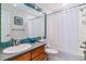 Bright bathroom with tile accents, modern fixtures, and a shower-tub combination for a relaxing space at 2831 Spruce St, Denver, CO 80238