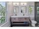 Stylish bathroom with dual sinks, modern vanities, and large windows providing plenty of natural light at 2831 Spruce St, Denver, CO 80238