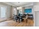 Classic dining room with modern chandelier, a dark wood table, and neutral decor at 2831 Spruce St, Denver, CO 80238