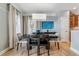 An elegant dining area features neutral colors and a stylish light fixture at 2831 Spruce St, Denver, CO 80238
