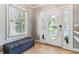 Bright foyer with gleaming wood floors and a stylish oval-glass front door at 2831 Spruce St, Denver, CO 80238