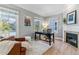 Cozy home office featuring a fireplace, natural light, and a comfortable workspace at 2831 Spruce St, Denver, CO 80238