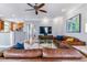 Spacious open living room with modern decor and seamless flow into the adjacent kitchen at 2831 Spruce St, Denver, CO 80238