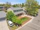 Eye-level view of the home showing landscaping, lawn, and long driveway to a two-car garage at 3653 E 133Rd Ct, Thornton, CO 80241