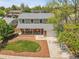 An aerial view showcases the landscaped front yard, driveway and exterior at 3653 E 133Rd Ct, Thornton, CO 80241