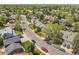 Neighborhood street view showcases lush greenery and well-maintained homes under a bright sky at 3653 E 133Rd Ct, Thornton, CO 80241