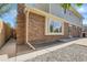 Home's exterior featuring brick siding, manicured landscaping, and an open patio area at 3653 E 133Rd Ct, Thornton, CO 80241