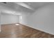 Expansive basement area features recessed lighting and hardwood floors, ready to be customized at 3653 E 133Rd Ct, Thornton, CO 80241