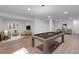 Finished basement offering a billiard table, seating area, and tv for entertaining at 3653 E 133Rd Ct, Thornton, CO 80241