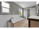 Elegant bathroom featuring a soaking tub, double vanity, and updated finishes for a spa-like retreat at 3653 E 133Rd Ct, Thornton, CO 80241