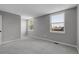 Neutral bedroom with two windows and carpeted floors at 3653 E 133Rd Ct, Thornton, CO 80241