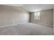 Spacious bedroom with neutral carpeting, vaulted ceilings, and a bright window at 3653 E 133Rd Ct, Thornton, CO 80241