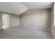 Large bedroom with neutral carpet, vaulted ceiling, and a doorway leading to another room at 3653 E 133Rd Ct, Thornton, CO 80241