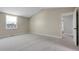 Large bedroom featuring neutral carpet, a vaulted ceiling, and a window with neighborhood views at 3653 E 133Rd Ct, Thornton, CO 80241