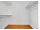 Walk-in closet with hardwood floors and shelving for optimized storage and organization at 3653 E 133Rd Ct, Thornton, CO 80241