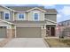 Charming home featuring a two-car garage, stone accents and craftsman details at 5671 Raleigh Cir, Castle Rock, CO 80104