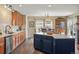 Modern kitchen with stainless steel appliances, center island, and hardwood floors at 5671 Raleigh Cir, Castle Rock, CO 80104
