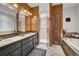 This primary bathroom provides a double vanity, a standing shower, and a soaking tub at 322 Davis Ct, Breckenridge, CO 80424