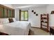 This cozy bedroom offers a large bed, soft textures, and a light-filled window at 322 Davis Ct, Breckenridge, CO 80424
