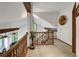 Bright hallway with wood banisters overlooking living area and views from large picture windows at 322 Davis Ct, Breckenridge, CO 80424