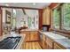 Open kitchen featuring wood cabinets, granite countertops, stainless steel appliances and an open view of dining room at 322 Davis Ct, Breckenridge, CO 80424