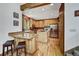 Well-equipped kitchen with light wood cabinets, granite countertops, stainless steel appliances, and hardwood floors at 322 Davis Ct, Breckenridge, CO 80424