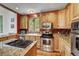 A spacious kitchen featuring stainless appliances, granite countertops, and wooden cabinets at 322 Davis Ct, Breckenridge, CO 80424