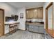 Charming kitchenette with wooden cabinets, built-in desk, and modern appliances, perfect for small meals and convenient refreshments at 322 Davis Ct, Breckenridge, CO 80424