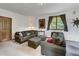 Cozy living room with comfortable seating, carpeted floors, and natural light from the window at 322 Davis Ct, Breckenridge, CO 80424