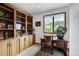 Office room featuring built in shelves and a large window with a picturesque view at 322 Davis Ct, Breckenridge, CO 80424