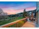 Outdoor deck area providing panoramic sunset views of the surrounding landscape at 87 Deerwood Dr, Littleton, CO 80127