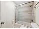 Bathroom showcasing a shower over tub combination with sliding glass doors at 87 Deerwood Dr, Littleton, CO 80127