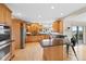 Well-equipped kitchen with granite countertops, custom cabinets, and stainless steel appliances at 87 Deerwood Dr, Littleton, CO 80127