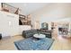 Bright living room with high ceilings, large windows, hardwood floors, and comfortable seating at 87 Deerwood Dr, Littleton, CO 80127