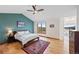 Bright main bedroom with hardwood floors, vaulted ceilings, and a ceiling fan at 87 Deerwood Dr, Littleton, CO 80127