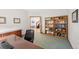 Traditional-style office with wooden desk, cabinets, and built-in bookshelf at 87 Deerwood Dr, Littleton, CO 80127