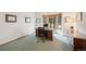 Office featuring a bay window, wood trim, and traditional furnishings at 87 Deerwood Dr, Littleton, CO 80127