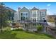 Two-story home with large deck, patio, and landscaped yard at 87 Deerwood Dr, Littleton, CO 80127