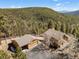 Overhead view of the property showing the house and the detached garage at 11648 Broken Arrow Dr, Conifer, CO 80433