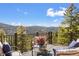 Scenic view from outdoor deck area featuring comfortable seating and incredible mountain views at 11648 Broken Arrow Dr, Conifer, CO 80433