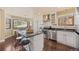 Bright kitchen with stainless steel appliances, granite countertops, and a window overlooking nature at 11648 Broken Arrow Dr, Conifer, CO 80433