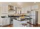 Well-appointed kitchen with stainless steel appliances, granite countertops, and a breakfast bar at 11648 Broken Arrow Dr, Conifer, CO 80433